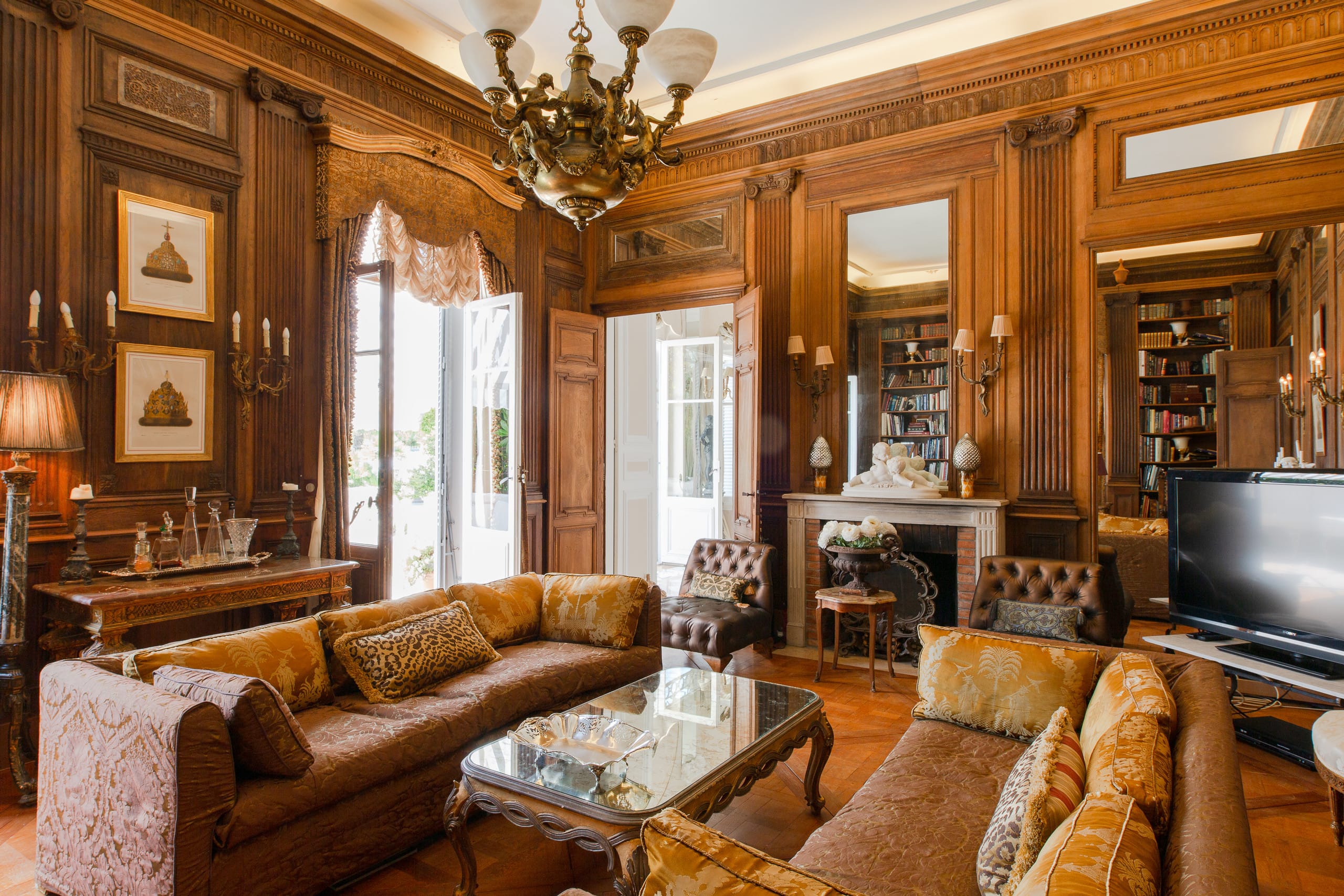 Wood-panelled library at Château Algarve